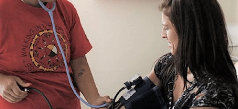woman getting blood pressure check